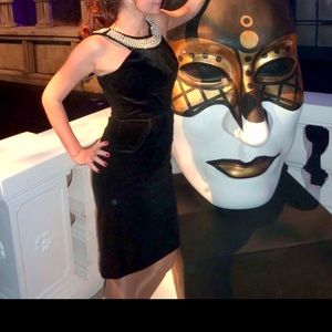 Perfect velvet black dress with pearlized neckline.